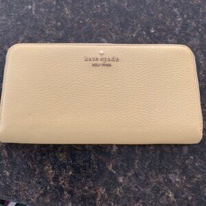 NWT Kate Spade New York yellow leather wallet.